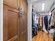 Spacious walk-in closet with built-in shelves and ample storage, perfect for organizing your wardrobe at 207 Linden Ave, Raleigh, NC 27601