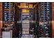 A well-stocked wine cellar featuring a decorative tile floor and custom shelving at 207 Linden Ave, Raleigh, NC 27601