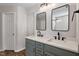 Bathroom with a double vanity, modern fixtures and mirrors at 2121 Ramsgate St, Raleigh, NC 27603