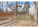 Wooden deck overlooks the backyard with partial fencing at 2121 Ramsgate St, Raleigh, NC 27603
