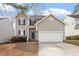 Charming two-story home featuring gray siding, a two-car garage, and a well-maintained front yard at 2121 Ramsgate St, Raleigh, NC 27603