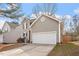 Beautiful home boasting gray siding, blue shutters, and a two-car garage, plus mature landscaping at 2121 Ramsgate St, Raleigh, NC 27603