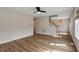Spacious living room with hardwood floors, a ceiling fan, and a staircase leading to the upper level at 2121 Ramsgate St, Raleigh, NC 27603