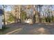 The large backyard includes a storage shed and mature trees providing ample shade and privacy at 214 Linville Ln, Willow Springs, NC 27592