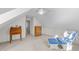Bedroom with vaulted ceilings, a writing desk, and a rocking chair for relaxation at 214 Linville Ln, Willow Springs, NC 27592