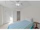 Cozy bedroom featuring a twin bed, a closet for storage, and a ceiling fan for comfort at 214 Linville Ln, Willow Springs, NC 27592