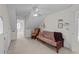 Bright bonus room with a futon, a rocking chair, and ample space for relaxing or entertaining at 214 Linville Ln, Willow Springs, NC 27592