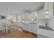 Modern kitchen featuring stainless steel appliances, ample counter space, and an adjacent dining area at 214 Linville Ln, Willow Springs, NC 27592