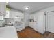 Bright kitchen boasts white appliances, ample cabinet space, and a functional layout at 214 Linville Ln, Willow Springs, NC 27592