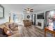 Comfortable living room with a fireplace, ceiling fan, and a view of the front yard at 214 Linville Ln, Willow Springs, NC 27592