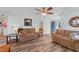 Cozy living room with two couches, ceiling fan, and a view of the front entrance at 214 Linville Ln, Willow Springs, NC 27592