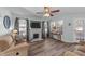 Bright living room features a fireplace, ceiling fan, and ample natural light at 214 Linville Ln, Willow Springs, NC 27592
