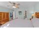 Bright main bedroom featuring wood furniture, and an ensuite bathroom for added convenience at 214 Linville Ln, Willow Springs, NC 27592