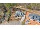 High-angle view of a home highlighting its well-manicured landscaping, spacious driveway, and serene setting at 2412 Toll Mill Ct, Raleigh, NC 27606