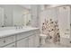 Bathroom featuring a floral shower curtain, a tub, and neutral-toned walls at 2412 Toll Mill Ct, Raleigh, NC 27606