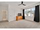 Spacious bedroom with an ensuite bathroom, TV, and ample natural light at 2412 Toll Mill Ct, Raleigh, NC 27606