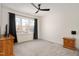 Large bedroom with natural light, neutral walls, and carpet at 2412 Toll Mill Ct, Raleigh, NC 27606