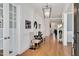 Inviting foyer featuring hardwood flooring and sophisticated decorative elements at 2412 Toll Mill Ct, Raleigh, NC 27606