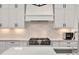 Close up of a Kitchen with Stainless Steel Stove and tiled backsplash at 2412 Toll Mill Ct, Raleigh, NC 27606