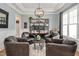 Cozy seating in a living room with natural light and an inviting atmosphere at 2412 Toll Mill Ct, Raleigh, NC 27606