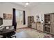 Study room with natural light and a wooden cabinet with storage space at 2412 Toll Mill Ct, Raleigh, NC 27606