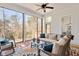 Comfortable sunroom with plenty of seating, natural light, and scenic outdoor views at 2412 Toll Mill Ct, Raleigh, NC 27606