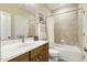 Bathroom with a shower-tub combo with tile surround, single sink vanity, and wood cabinets at 242 Sweet Pine Cir, Pittsboro, NC 27312