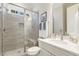 Bathroom featuring tiled shower with glass, single vanity, and marble countertop at 242 Sweet Pine Cir, Pittsboro, NC 27312