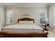 Bedroom featuring neutral carpet, ceiling fan, and windows with lots of natural light at 242 Sweet Pine Cir, Pittsboro, NC 27312