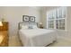 Bright bedroom with a large window with views and a comfortable bed at 242 Sweet Pine Cir, Pittsboro, NC 27312
