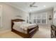 Spacious bedroom with neutral carpet, ceiling fan, and windows with lots of natural light at 242 Sweet Pine Cir, Pittsboro, NC 27312