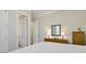 Bedroom with a comfortable bed and a dresser featuring lamps and a mirror at 242 Sweet Pine Cir, Pittsboro, NC 27312