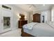 Bedroom with neutral carpet, ceiling fan, access to porch, and large wooden dresser at 242 Sweet Pine Cir, Pittsboro, NC 27312