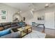Comfortable bonus room boasts a large sectional, ceiling fan, exercise equipment and ample space at 242 Sweet Pine Cir, Pittsboro, NC 27312