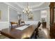 Open dining room with backyard views, decorative rug, and hardwood flooring at 242 Sweet Pine Cir, Pittsboro, NC 27312