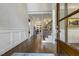 Inviting foyer with hardwood floors and a staircase leading to the second floor at 242 Sweet Pine Cir, Pittsboro, NC 27312