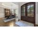 Elegant entryway with wood floors and an open view to the dining area at 242 Sweet Pine Cir, Pittsboro, NC 27312