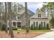 Beautiful home with stone accents, covered porch, and manicured landscaping at 242 Sweet Pine Cir, Pittsboro, NC 27312