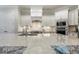 Bright kitchen with stainless steel appliances and large, light countertop island at 242 Sweet Pine Cir, Pittsboro, NC 27312