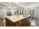 Gourmet kitchen featuring a large island with bar seating and stainless steel appliances at 242 Sweet Pine Cir, Pittsboro, NC 27312