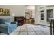 Bright living space with access to back porch, wet bar, piano, and hardwood flooring at 242 Sweet Pine Cir, Pittsboro, NC 27312