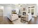 Inviting living room with hardwood floors, fireplace, and ample natural light at 242 Sweet Pine Cir, Pittsboro, NC 27312