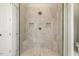 Modern glass shower stall with tiled walls, bench seating and dual shower heads at 242 Sweet Pine Cir, Pittsboro, NC 27312