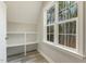 Bright nook featuring a window with wooded views, a built-in shelf, and luxury vinyl plank flooring at 242 Sweet Pine Cir, Pittsboro, NC 27312