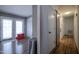 Hallway showing durable floors, closet and a view of the outdoor patio through the door at 2518 Pilot Riley Rd, Zebulon, NC 27597