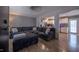 Comfortable living room featuring a large sectional sofa, hardwood floors, and an open layout at 2518 Pilot Riley Rd, Zebulon, NC 27597