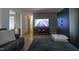 Cozy living room featuring a TV, wood entertainment center, and hardwood floors at 2518 Pilot Riley Rd, Zebulon, NC 27597
