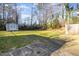 Expansive backyard featuring a storage shed and mature trees at 2606 Landis Dr, Durham, NC 27705