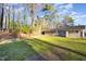 Large, open backyard with mature trees providing shade and privacy at 2606 Landis Dr, Durham, NC 27705