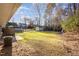 Expansive backyard featuring a storage shed, large lawn, and patio area at 2606 Landis Dr, Durham, NC 27705